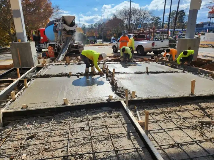 Our crew placing concrete over a rebar mat for a foundation slab in Little Elm, TX