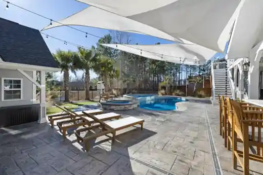 Stamped concrete pool deck in a Little Elm, TX backyard